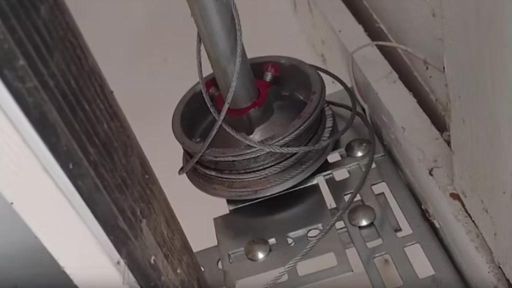 Damaged or tangled garage door cables in need of repair