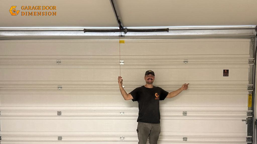 Licensed technician in Santa Ana presenting a finished garage door replacement service
