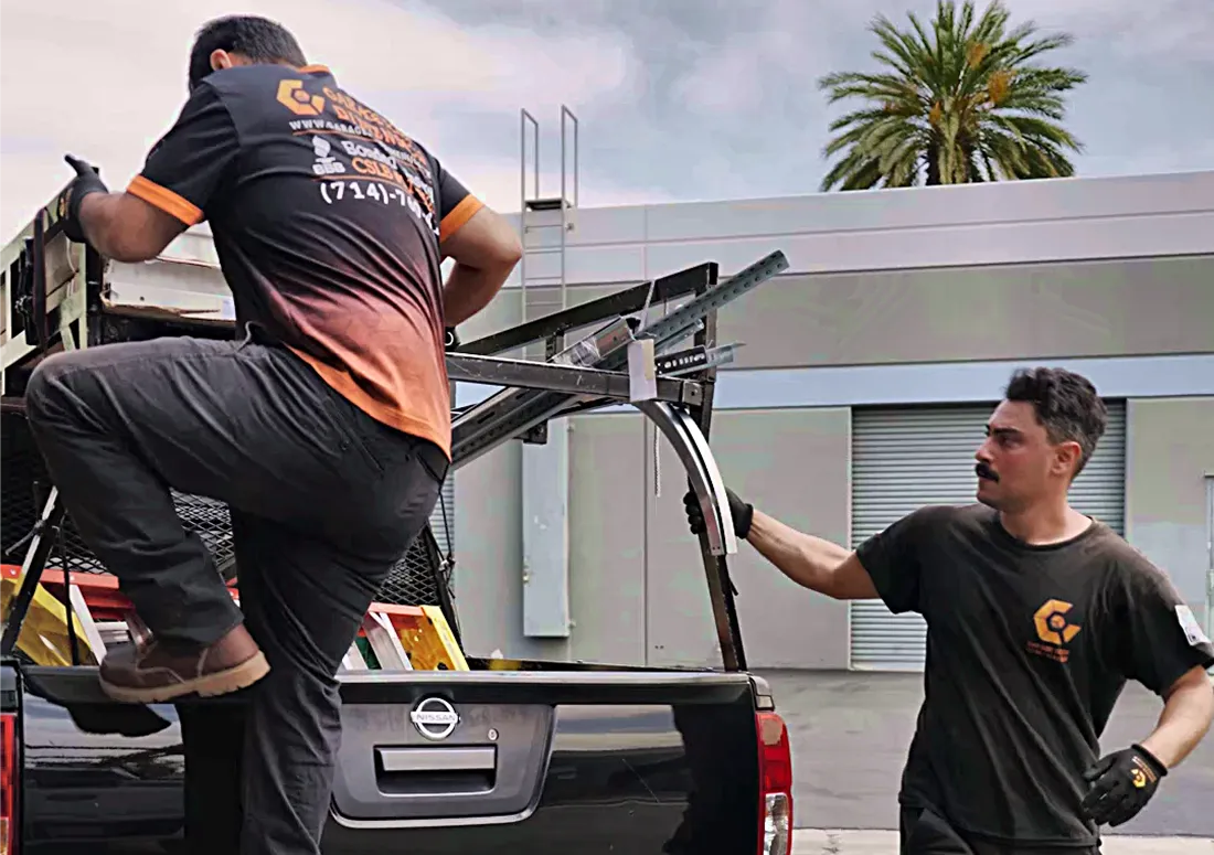 Garage Door Dimension technicians with service truck in Santa Ana, CA