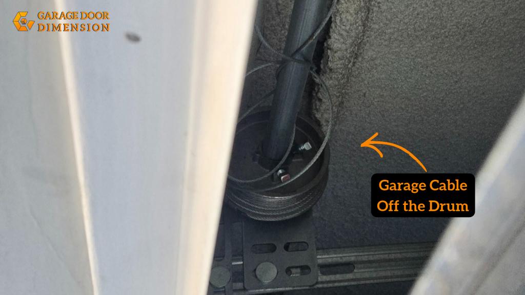 Garage door cable off the drum, showing a cable that has slipped away from the cable drum